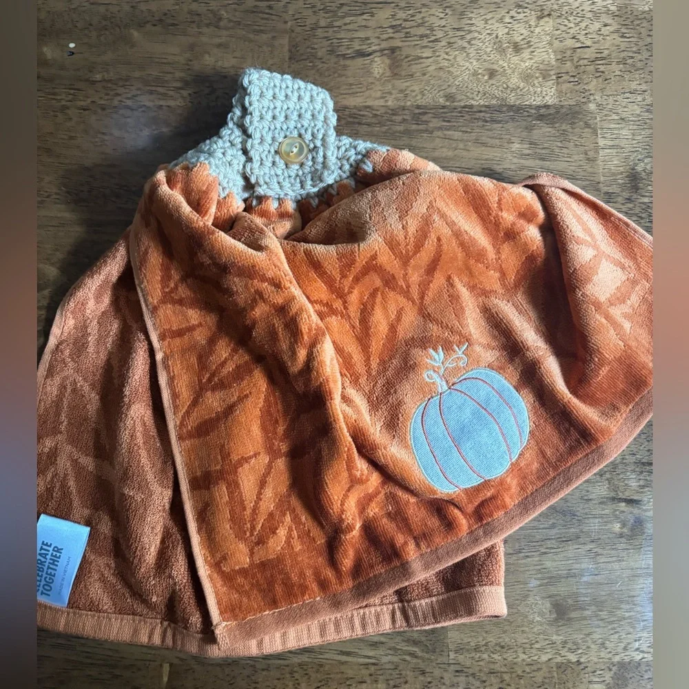 Hand crocheted orange fall towel with embroidered pumpkin